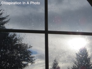 Rain and sun through window