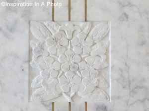 Carved marble motif in wall