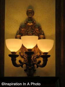 Ornate bronze wall sconce_front