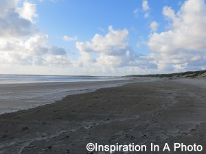 Footsteps on sandy beach